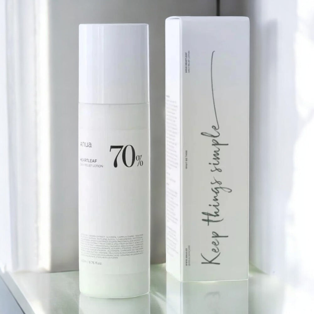 Skin TOGO Anua Heartleaf 70% Daily Lotion bottle and its minimalist white packaging box on a reflective surface.
