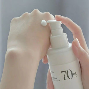 Skin TOGO Anua Heartleaf 70% Daily Lotion dispensed on hand showing lightweight white cream texture