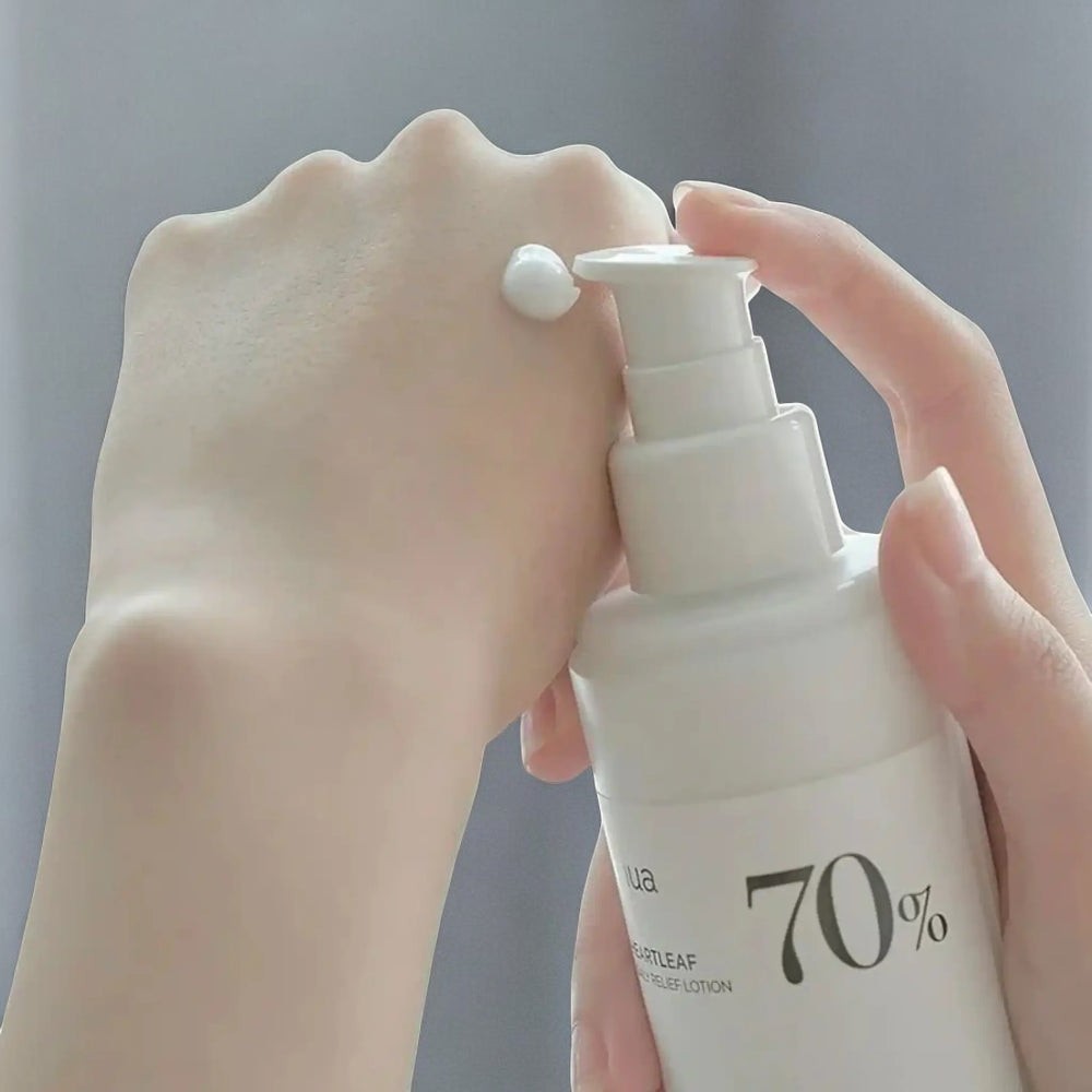 Skin TOGO Anua Heartleaf 70% Daily Lotion dispensed on hand showing lightweight white cream texture