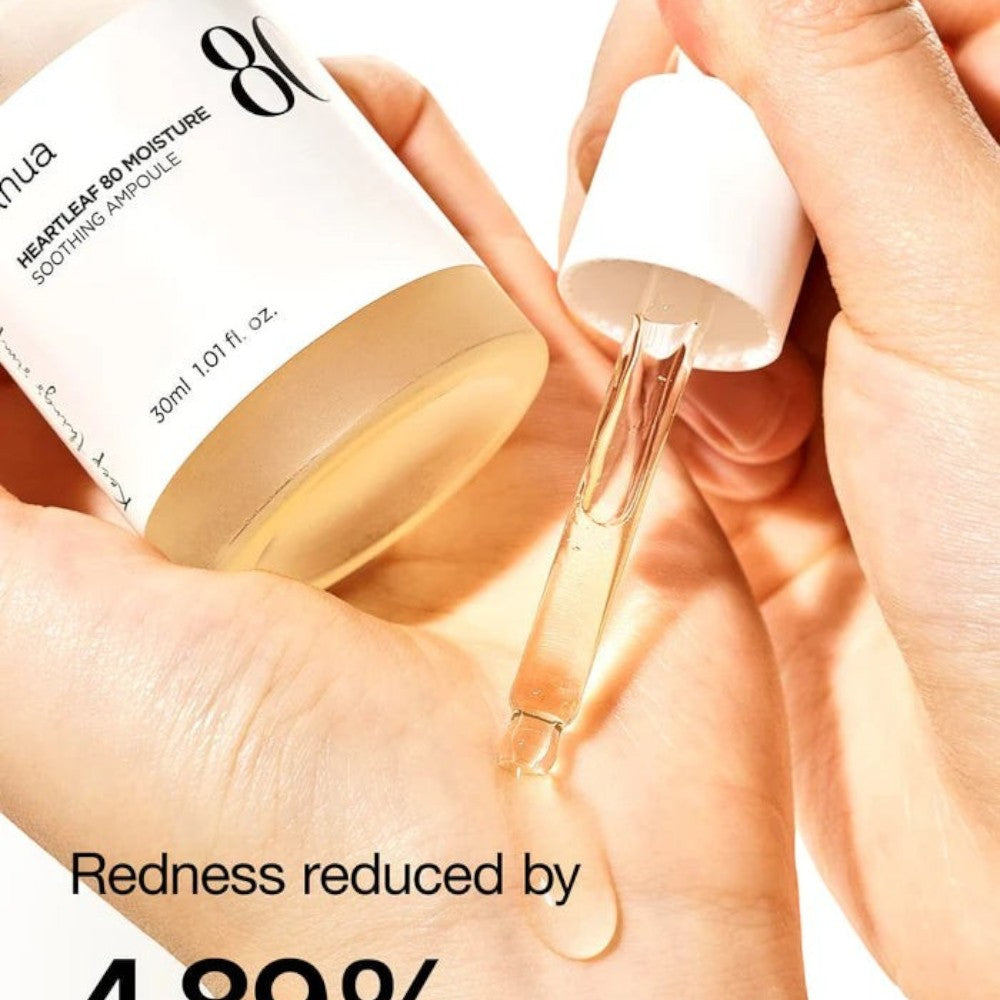 Skin TOGO Anua Heartleaf 80% Soothing Ampoule being applied with a dropper to a hand to show its clear serum texture.