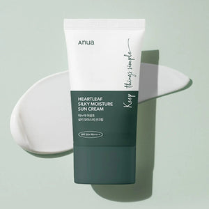 Skin TOGO Anua Heartleaf Silky Moisture Sun Cream SPF50+ in a dark green and white tube with a cream swatch.