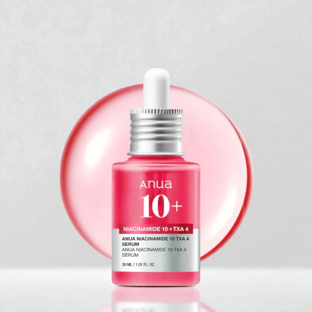 Skin TOGO Anua Niacinamide 10% + TXA 4% brightening serum in a pink 30ml dropper bottle against a soft pink background.