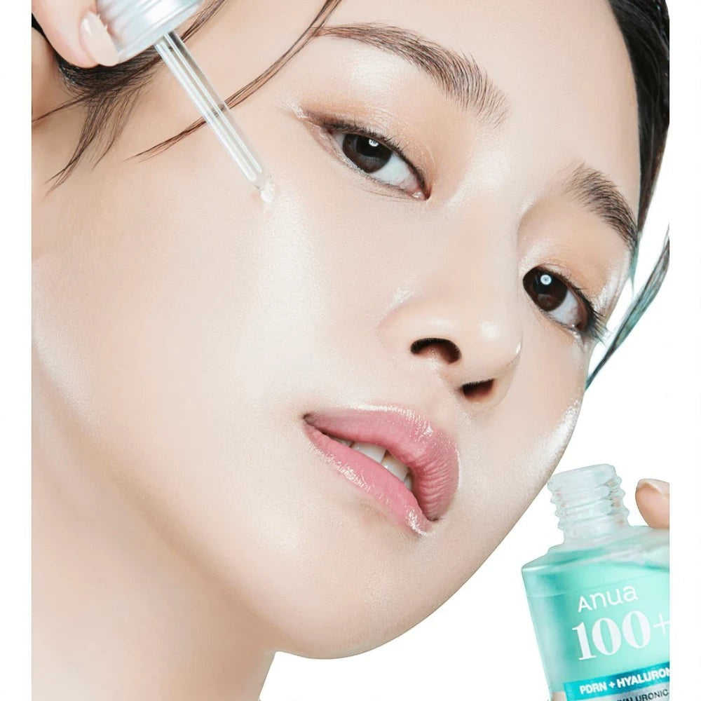 Skin TOGO model applying Anua PDRN Hyaluronic Acid Capsule 100 Serum to her face for a hydrated, glowing complexion.