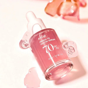Skin TOGO Anua Peach 70% Niacin Serum in a glass dropper bottle with pink serum texture on a light background