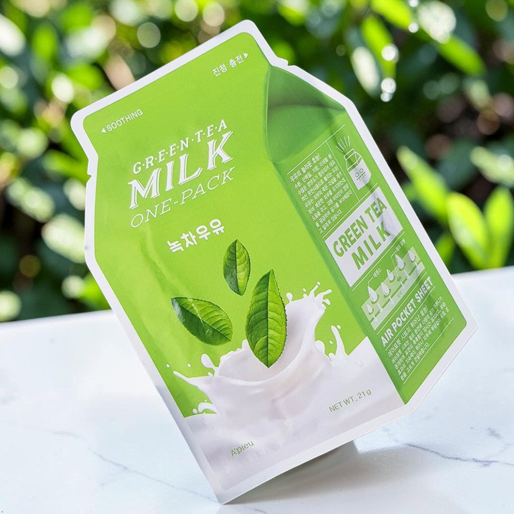 Skin TOGO A'PIEU Milk One Pack Green Tea sheet mask packaging featuring milk splash and tea leaves against green foliage