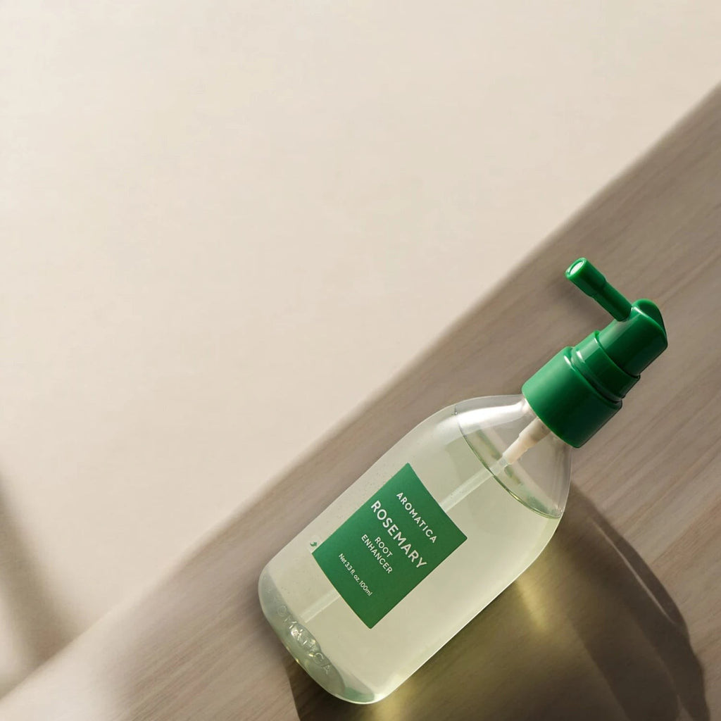 Skin TOGO Aromatica Rosemary Root Enhancer 100ml hair serum in a clear bottle with a green pump dispenser.