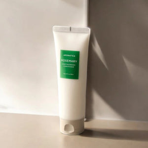 Skin TOGO Aromatica Rosemary Scalp Scaling shampoo in a white squeeze tube with a green label on a neutral surface.