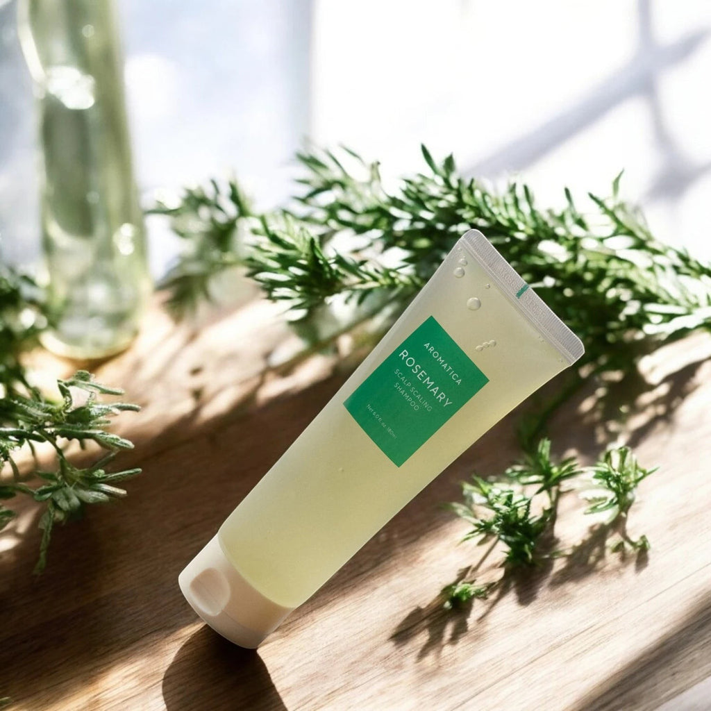 Skin TOGO Aromatica Rosemary Scalp Scaling Shampoo in a transparent tube with green label on a wooden surface