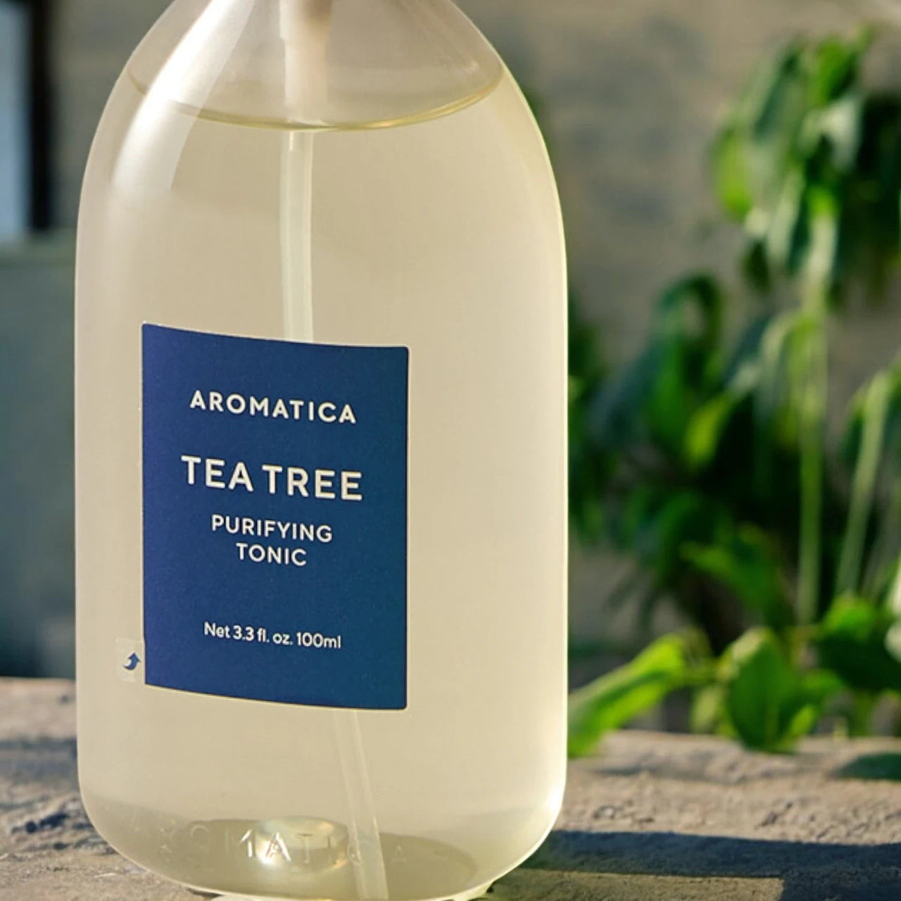 Skin TOGO Aromatica Tea Tree Purifying Tonic in a clear 100ml spray bottle for oily scalp care.