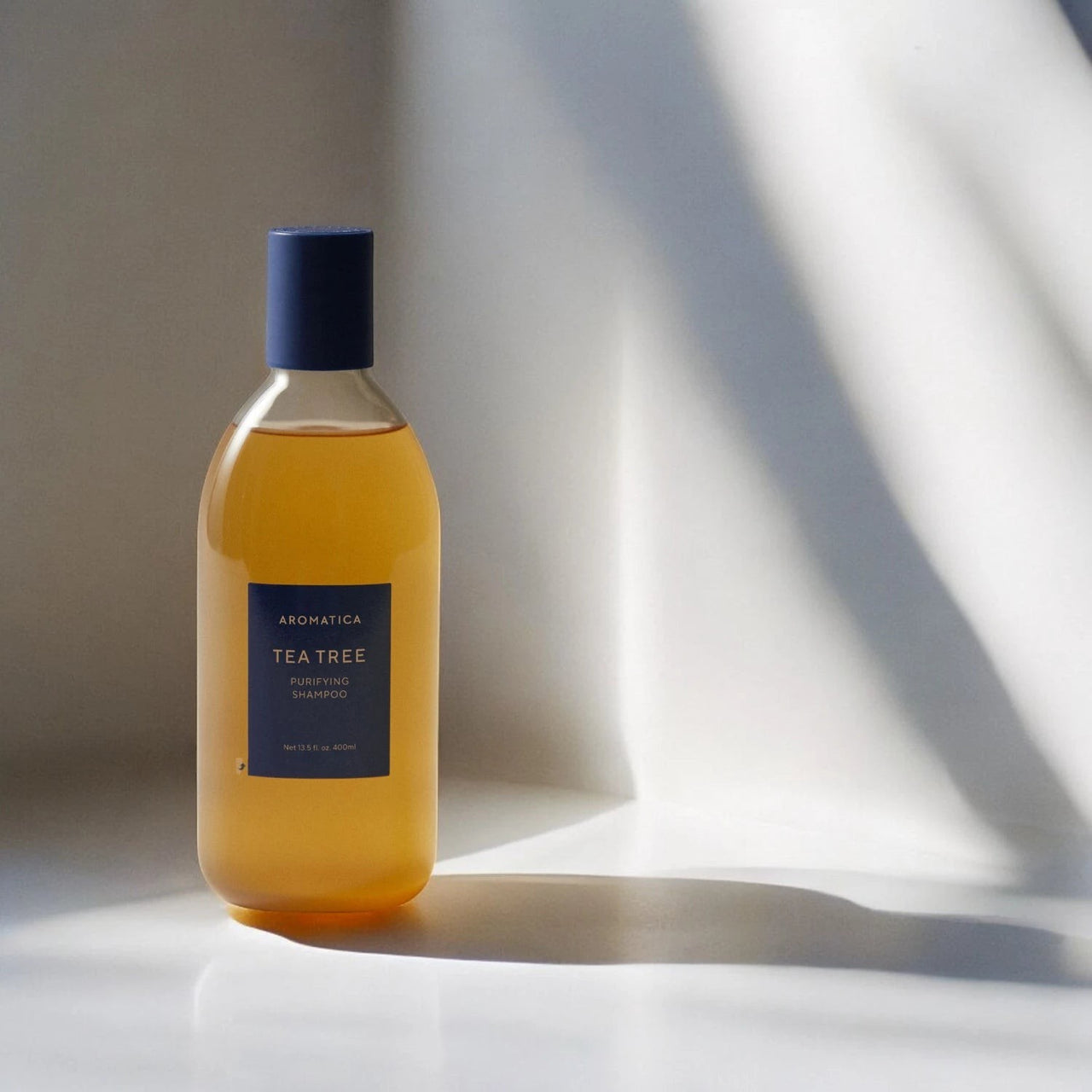 Skin TOGO Aromatica Tea Tree Purifying Shampoo in a 400ml amber bottle for oily and irritated scalps.