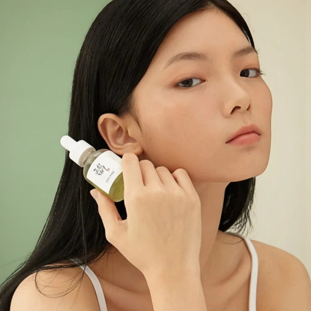 Skin TOGO model holding Beauty of Joseon Calming Serum with green tea and panthenol for sensitive skin