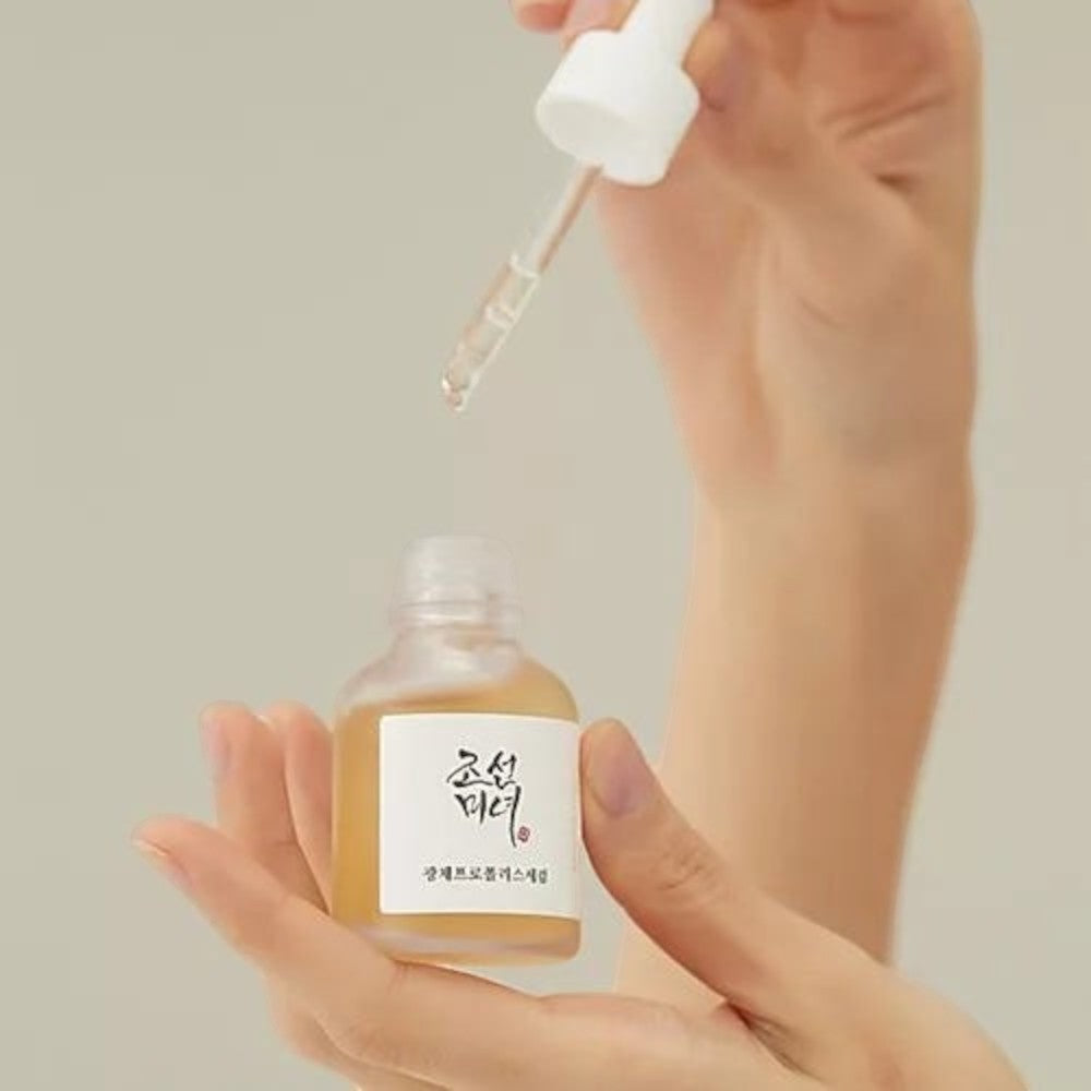 Skin TOGO Beauty of Joseon Glow Serum with propolis and niacinamide being applied with a dropper