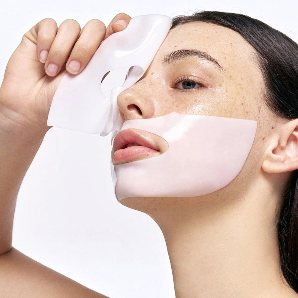 Skin TOGO Biodance Bio-Collagen Real Deep Mask on a model's face, showing the white hydrogel sheet texture.