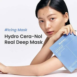 Skin TOGO model holding a blue Biodance Hydro Cera-Nol Real Deep Mask packet for intensive skin barrier hydration.