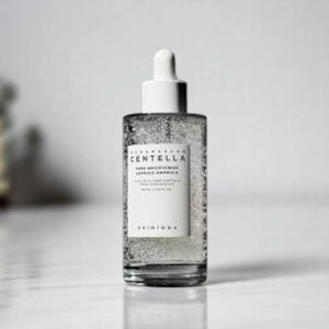 Skin TOGO Centella Tone Capsule Ampoule in a clear glass dropper bottle with visible brightening capsules.