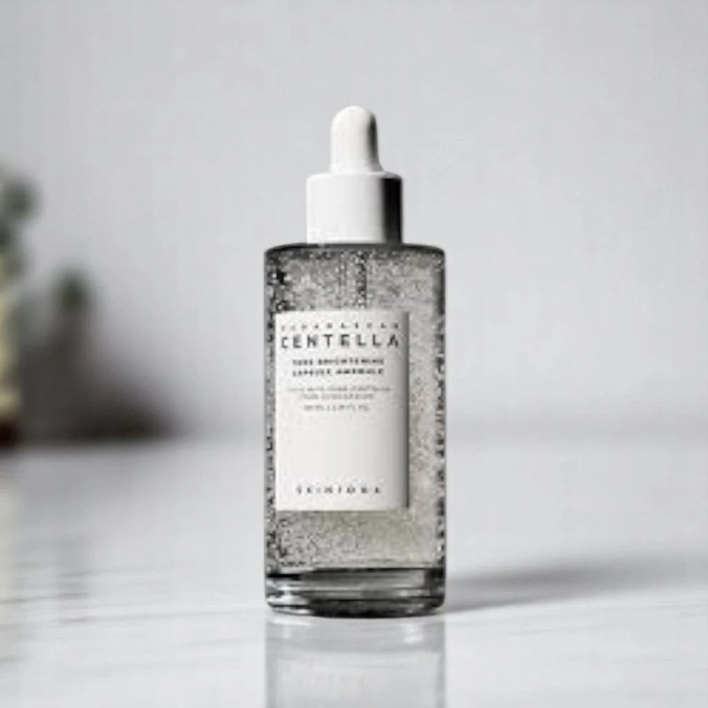Skin TOGO Centella Tone Capsule Ampoule in a clear glass dropper bottle with visible brightening capsules.