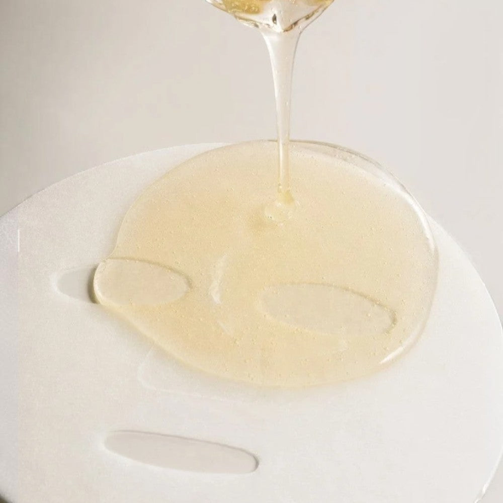 Skin TOGO Madagascar Centella Watergel Sheet Mask being saturated with a soothing, clear hydrating ampoule essence.