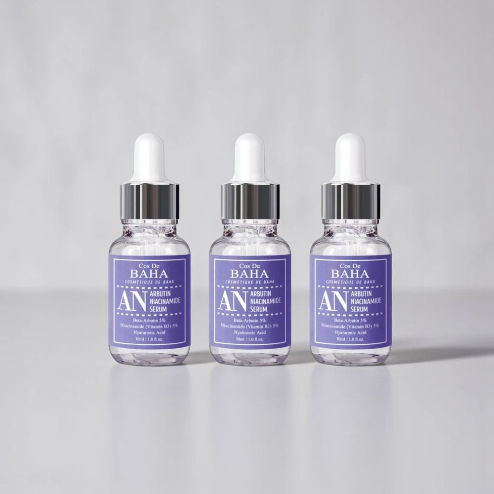 Skin TOGO Cos De BAHA AN Arbutin Niacinamide Serum bottles featuring purple labels for brightening skin tone