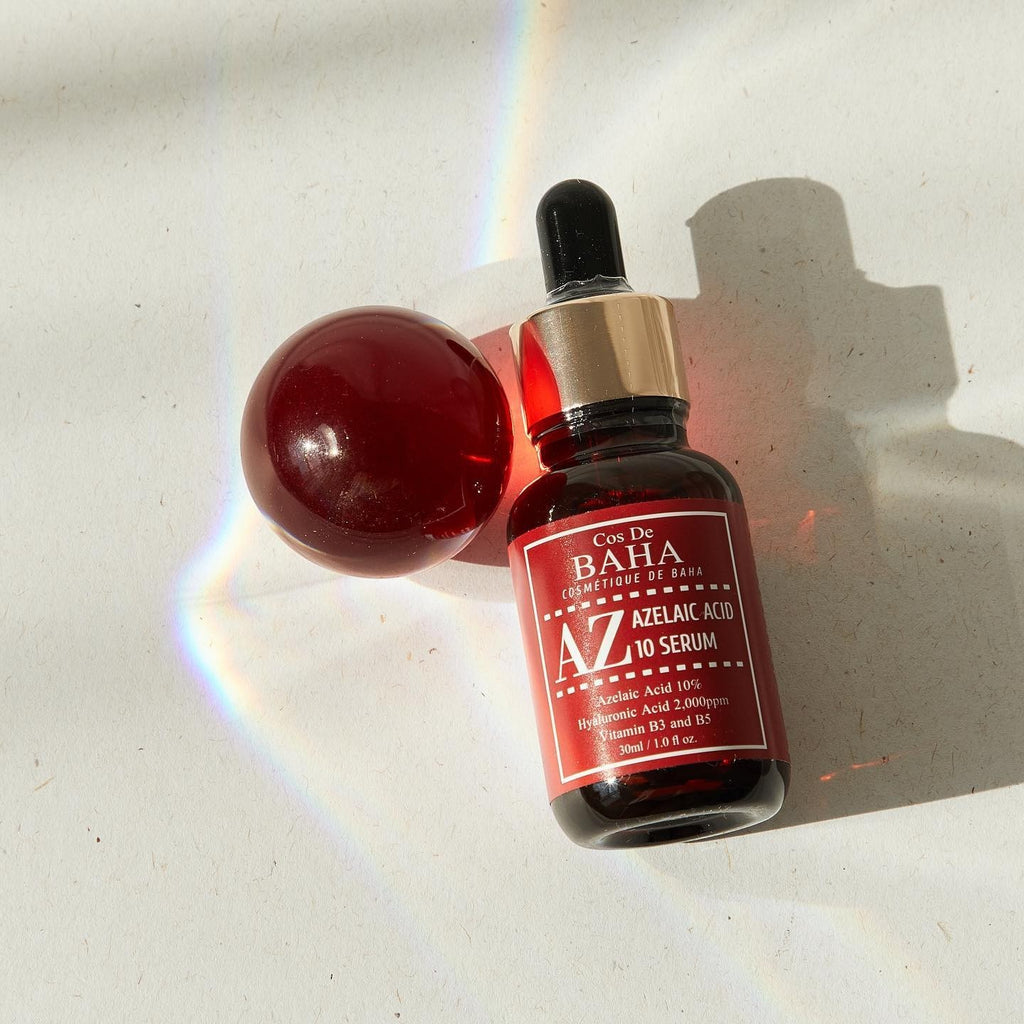 Skin TOGO Cos De BAHA AZ Azelaic Acid 10 serum in a dark glass dropper bottle with a red label on a white surface.