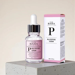 Skin TOGO Cos De BAHA P.M.A Peptide Serum bottle and box on a concrete block for anti-aging skincare.