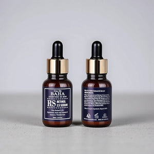Skin TOGO Cos De BAHA RS Retinol 2.5% serum bottles showing front label and ingredient list on a grey surface.