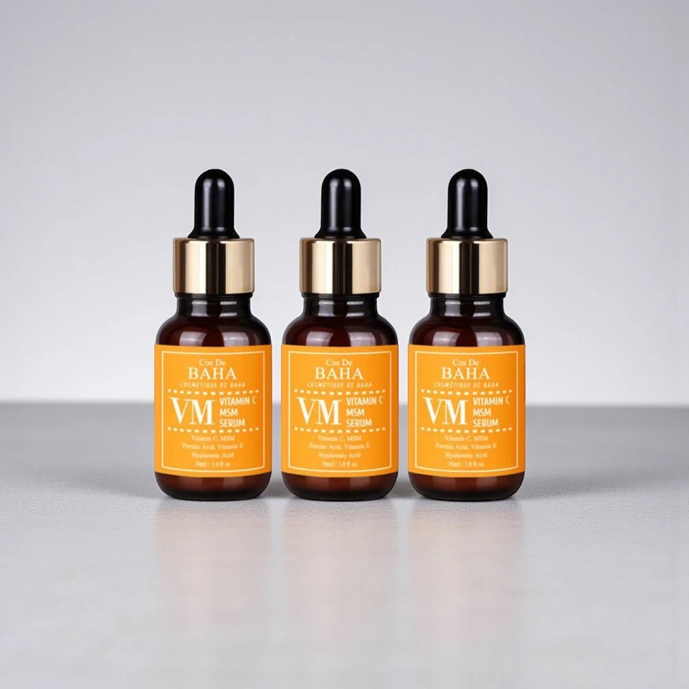 Skin TOGO Cos De BAHA VM Vitamin C MSM serum bottles in amber glass with droppers for brightening and antioxidant care.