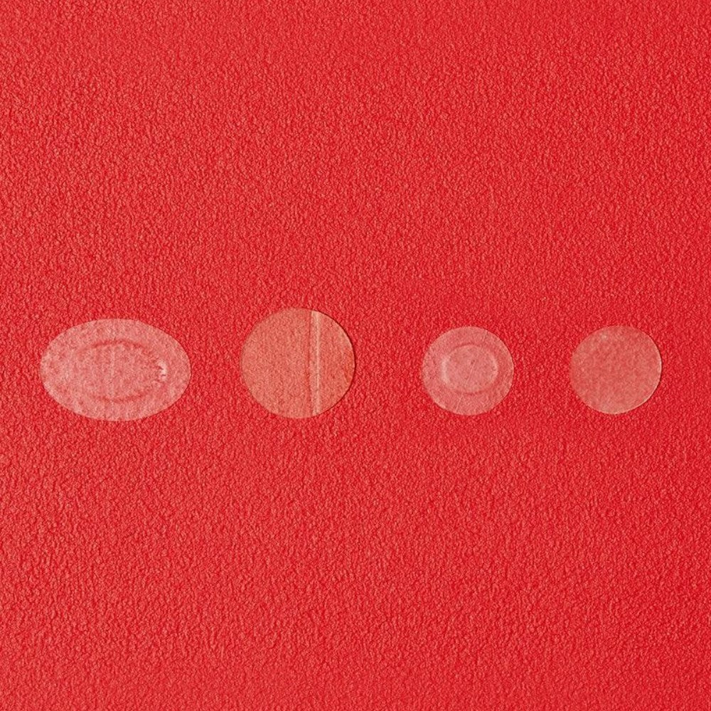 Skin TOGO Cosrx AC Collection hydrocolloid acne patches in various sizes displayed on a vibrant red textured background.