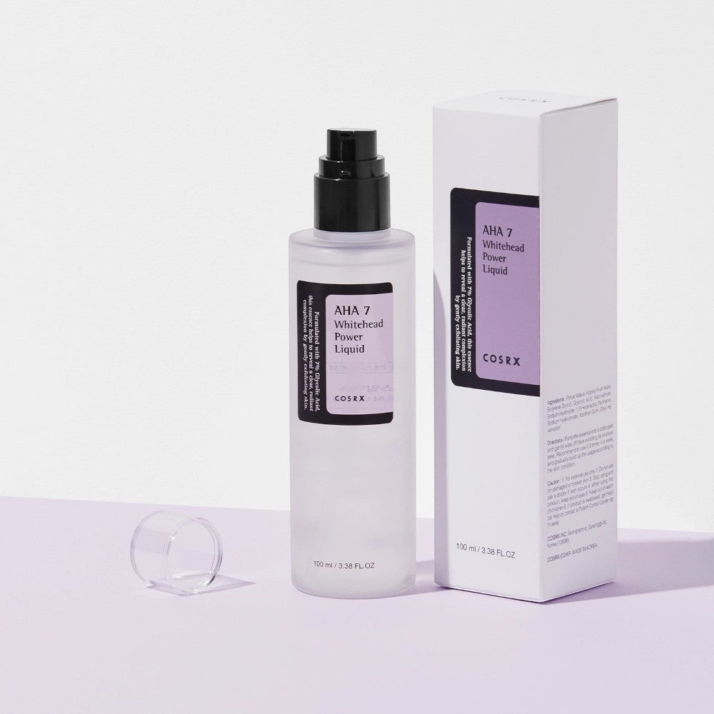 Skin TOGO Cosrx AHA 7 Whitehead Power Liquid chemical exfoliant bottle and packaging box on a light purple surface.