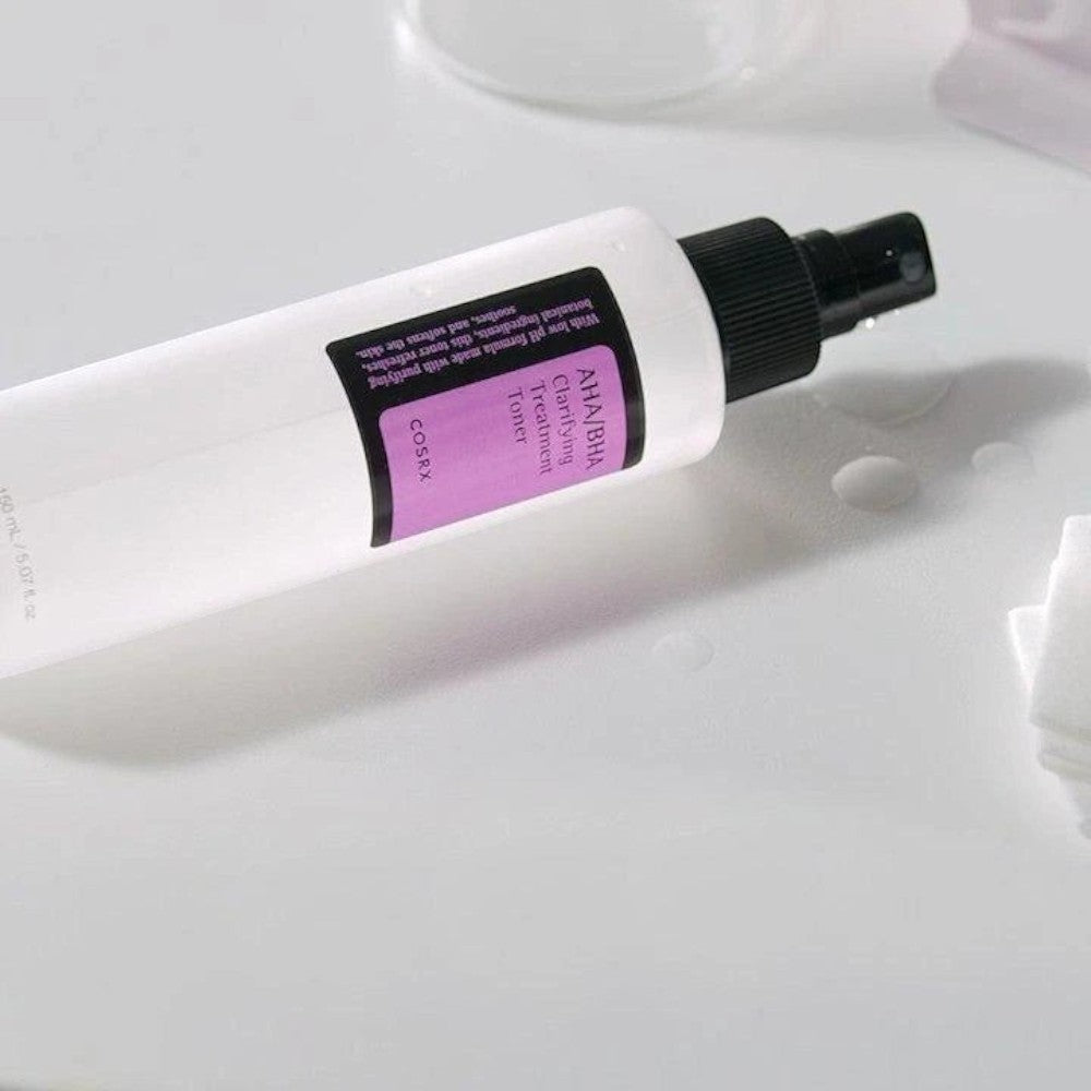 Skin TOGO COSRX AHA/BHA Clarifying Treatment Toner in a white spray bottle on a clean surface.