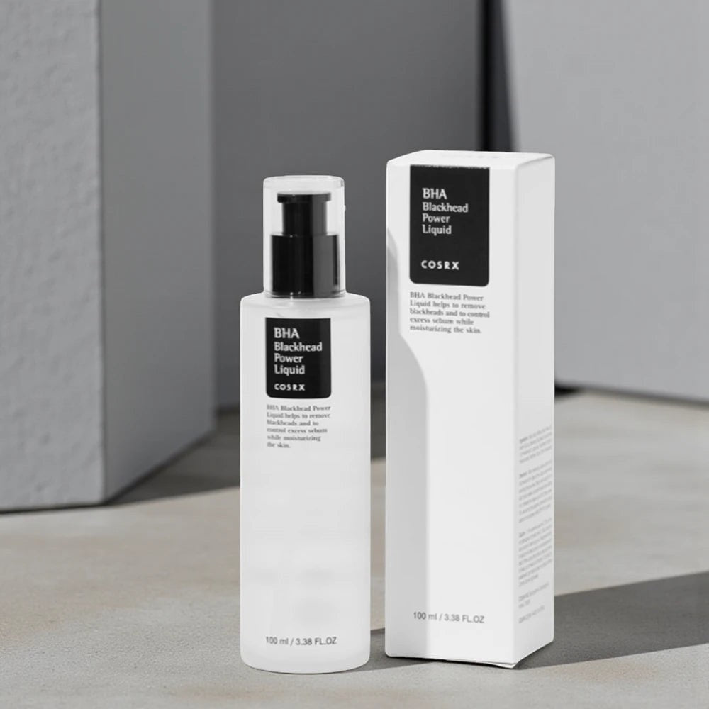 Skin TOGO Cosrx BHA Blackhead Power Liquid exfoliating serum bottle and box on a minimalist grey background.