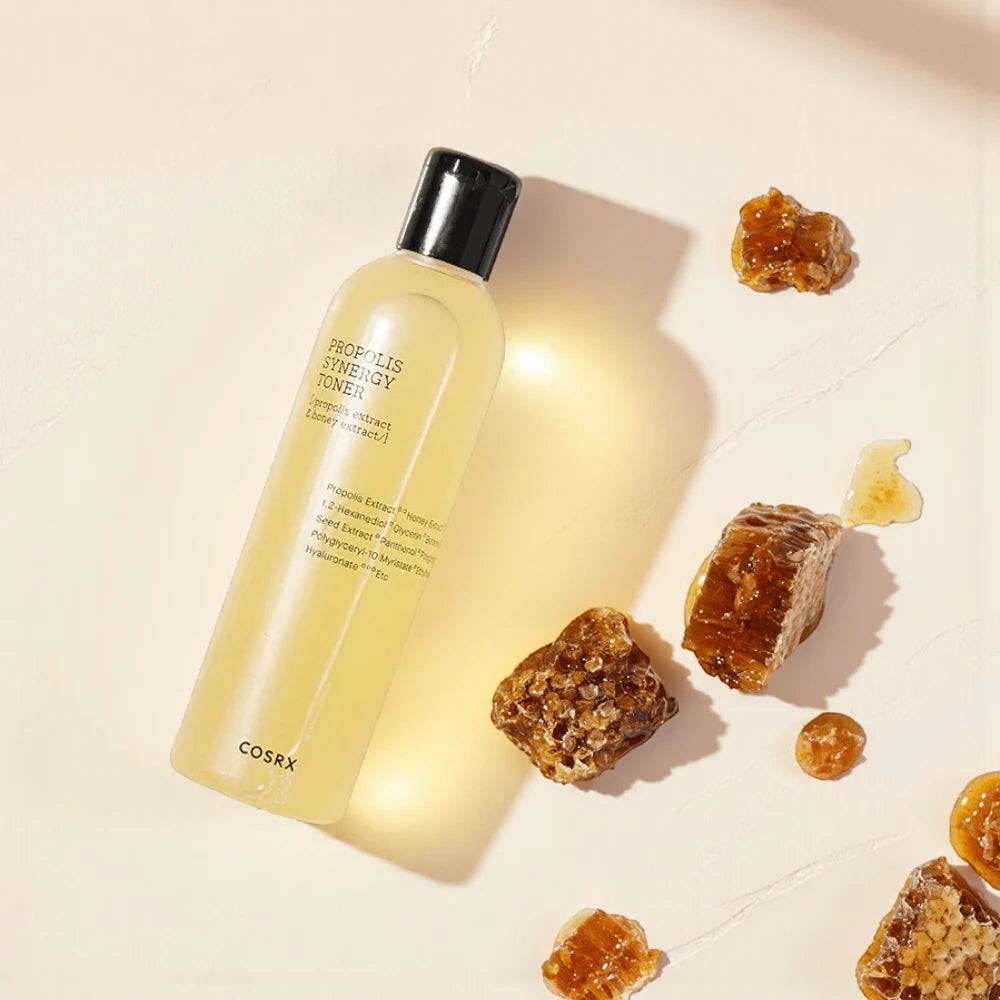 Skin TOGO COSRX Full Fit Propolis Synergy Toner bottle with honeycomb pieces on a light background