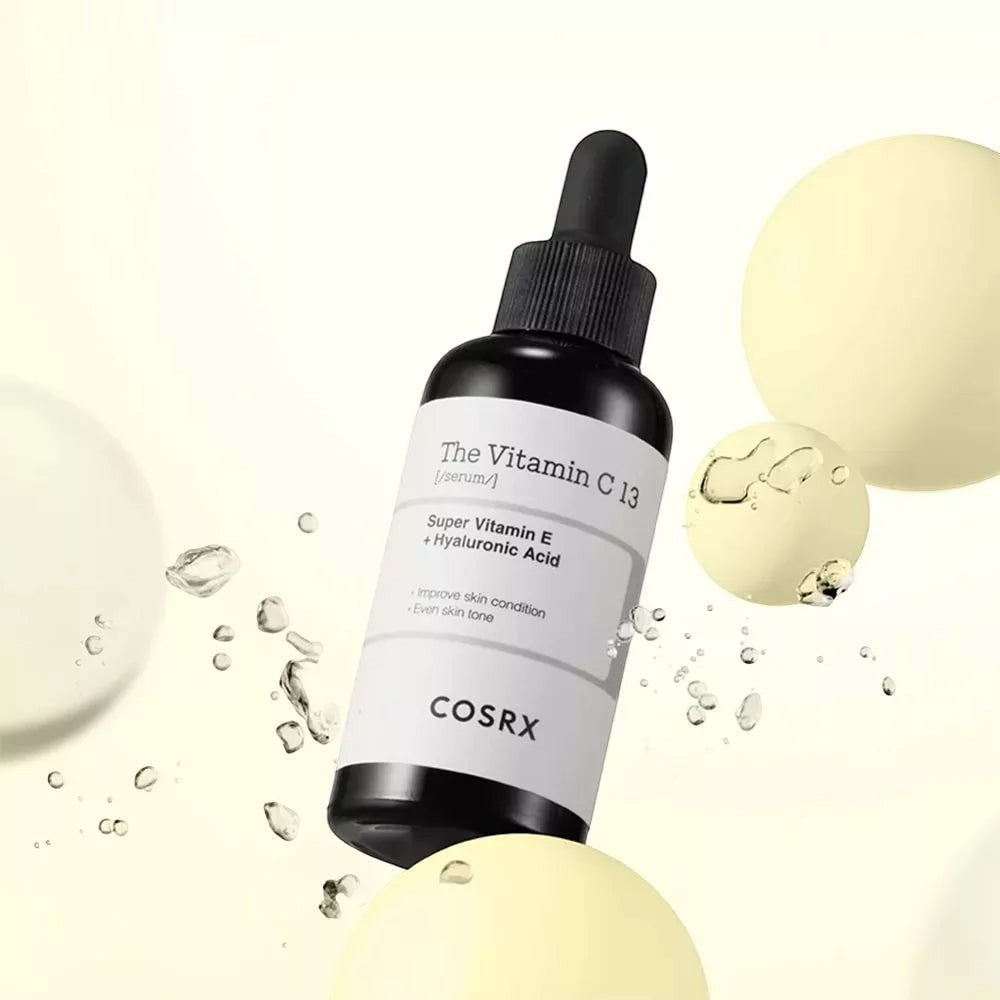 Skin TOGO COSRX The Vitamin C 13 Serum bottle with dropper, featuring 13% pure Vitamin C for brightening skin tone.