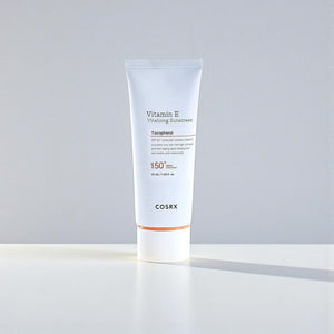 Skin TOGO COSRX Vitamin E Vitalizing Sunscreen SPF 50+ in a white 50ml tube with orange accents on a white surface.