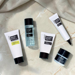 Skin TOGO Coxir Black Snail Starter Kit featuring four anti-aging skincare products with snail mucin and collagen.