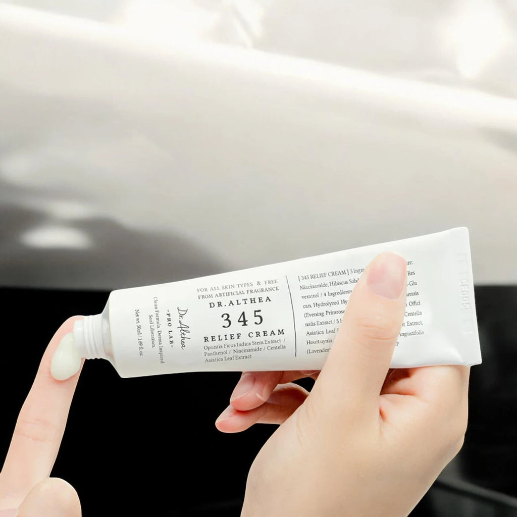Skin TOGO Dr.Althea 345 Relief Cream in a white tube being squeezed to show the soothing moisturizing cream texture