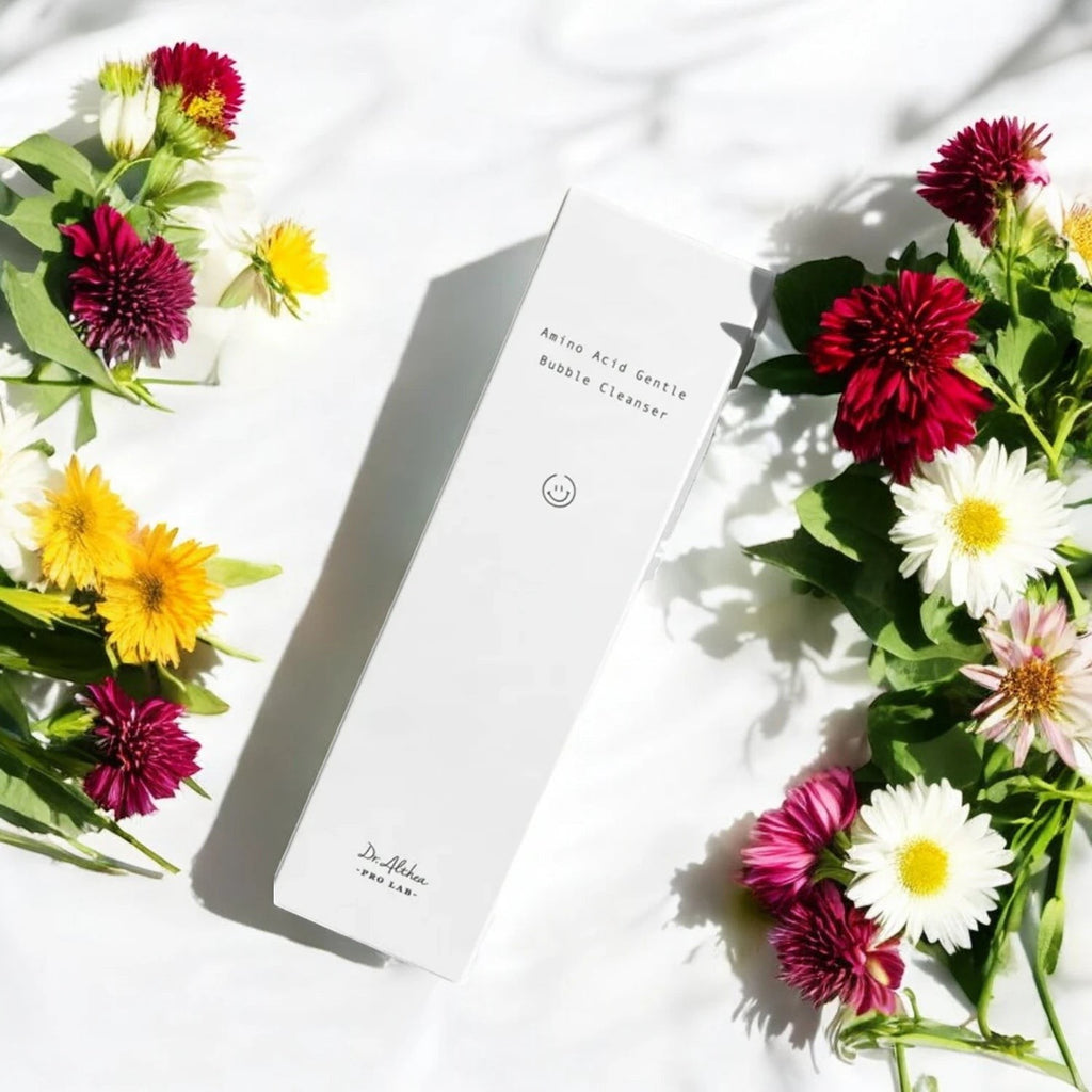 Skin TOGO Dr.Althea Amino Acid Gentle Bubble Cleanser box surrounded by colorful flowers on a white background.
