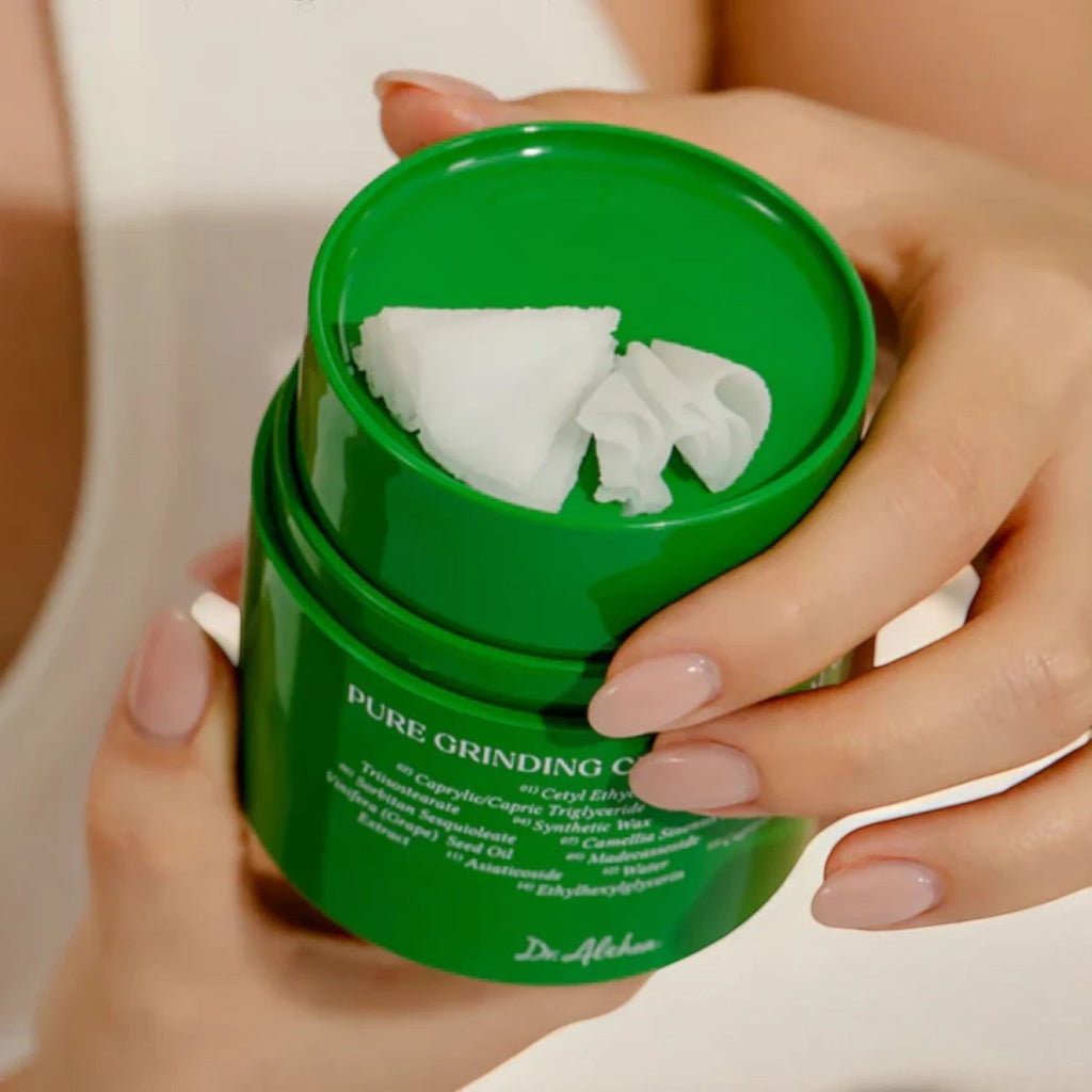 Skin TOGO Dr.Althea Pure Grinding Cleansing Balm in a green jar with white balm texture being dispensed