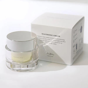 Skin TOGO Dr.Althea Niathione Cream in a clear glass jar with a white lid next to its white product packaging box.