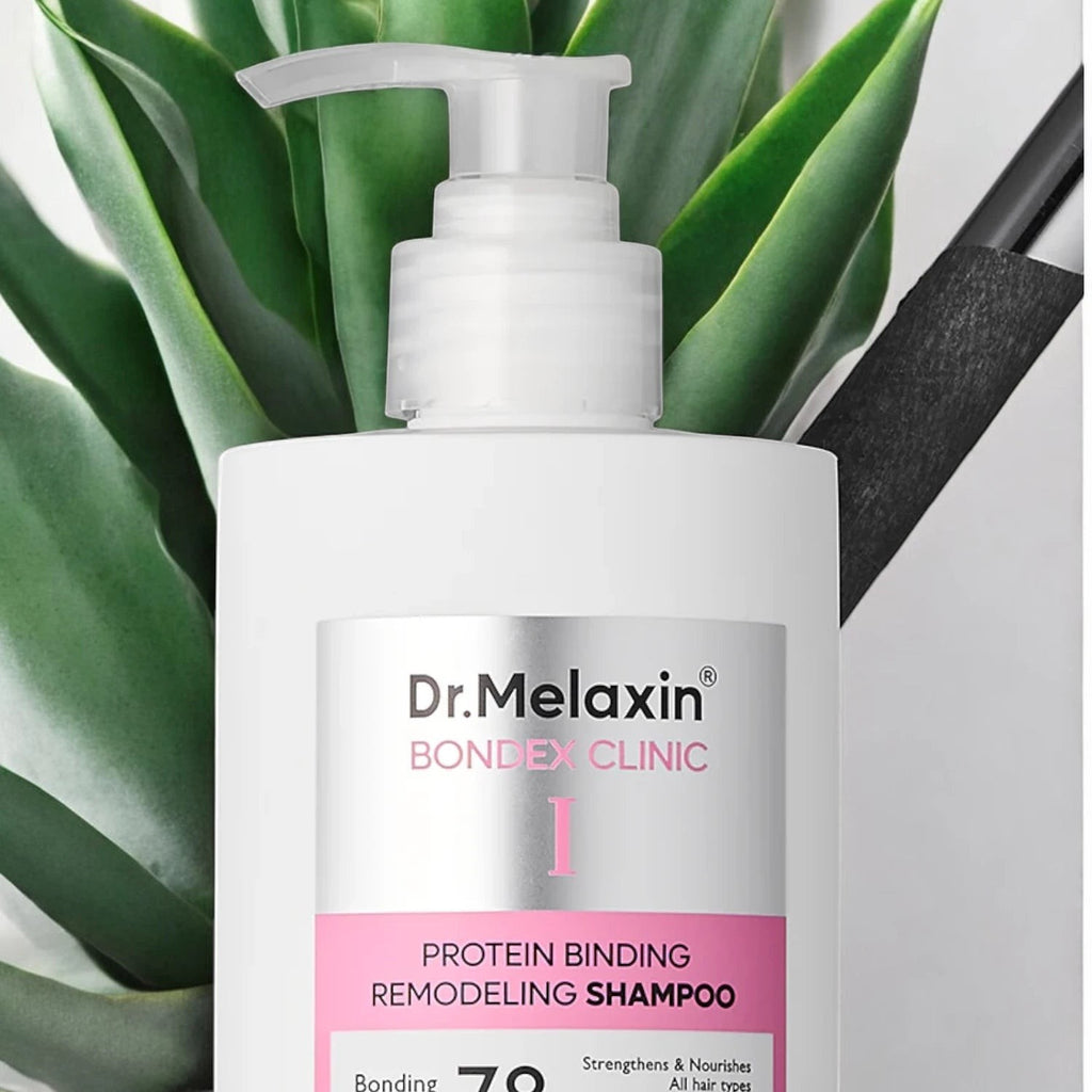 Skin TOGO Dr.Melaxin Bondex Protein Bonding Remodeling Shampoo in a white pump bottle against green leaves.