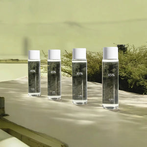 Skin TOGO Dr.Althea Anastatica Skin Conditioning Toner bottles featuring 85% extract in a natural outdoor setting.