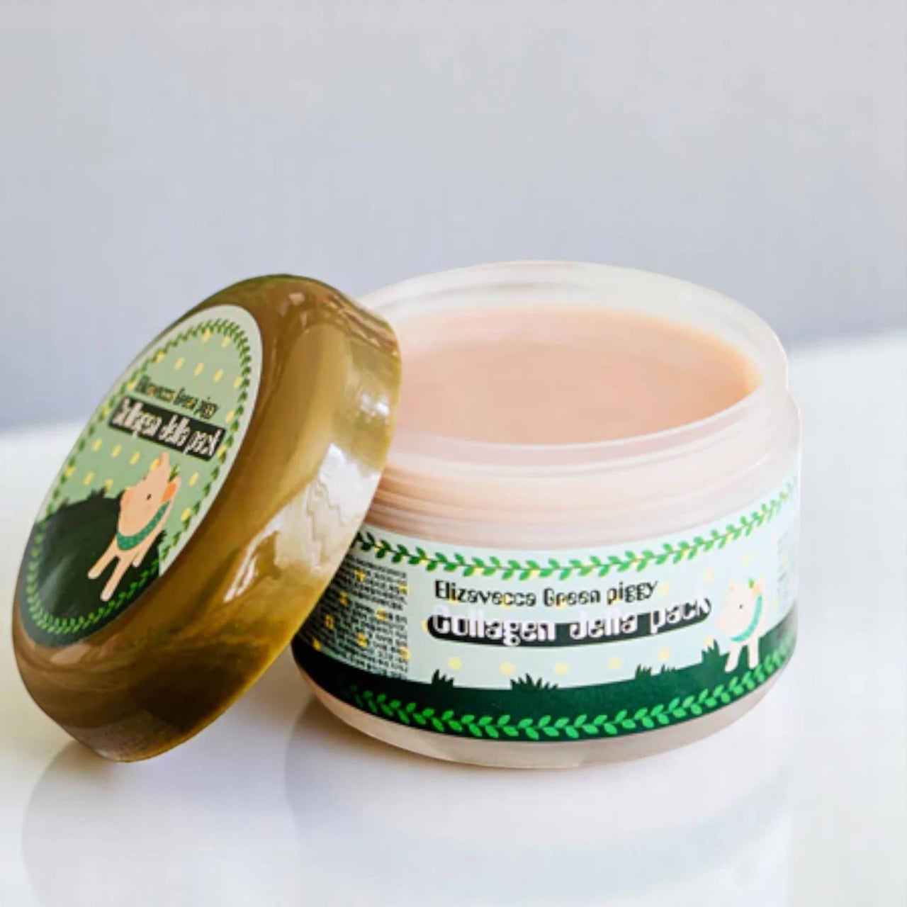 Skin TOGO Elizavecca Green Piggy Collagen Jella Pack jar with open lid showing pink hydrating jelly mask texture