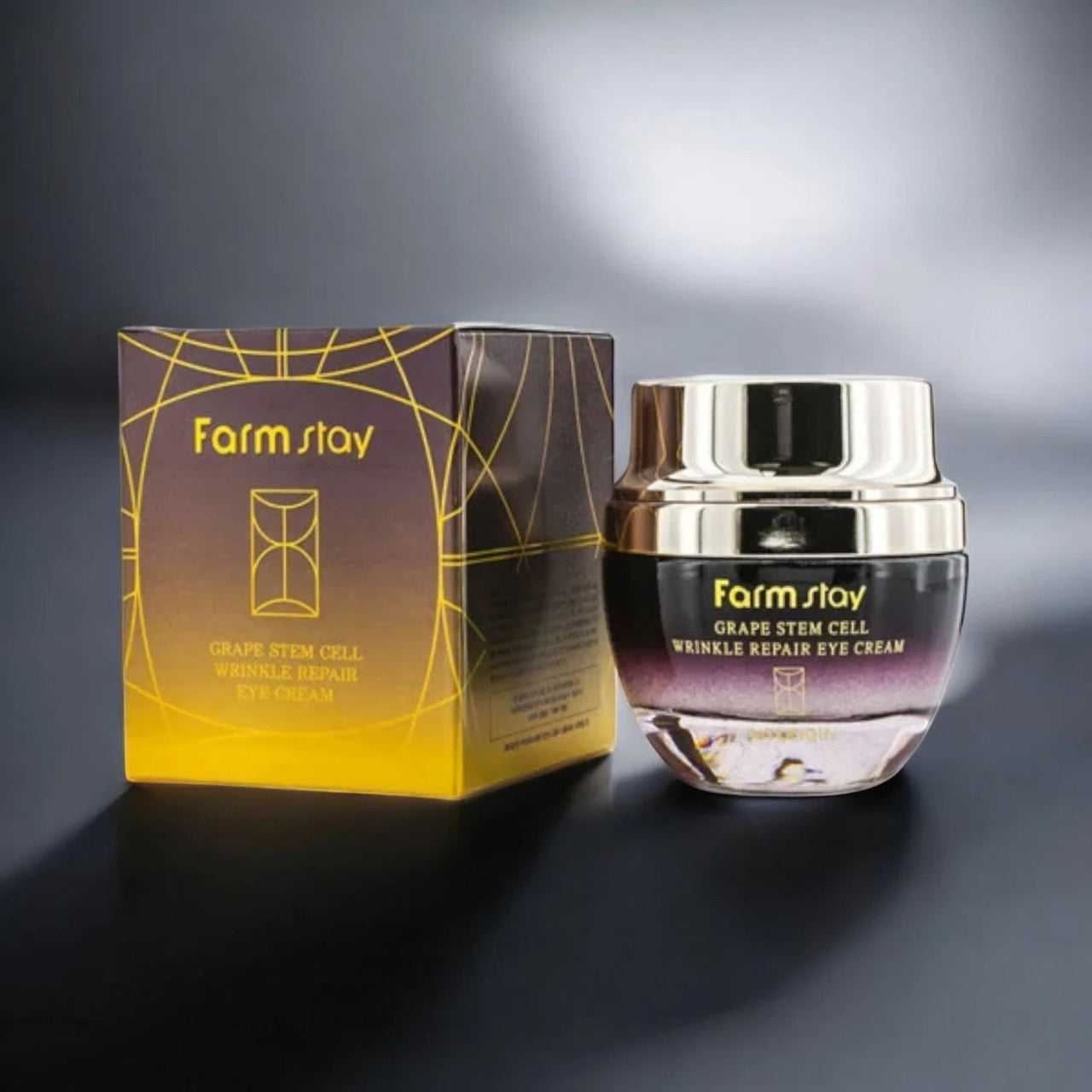 Skin TOGO Farmstay Grape Stem Cell Wrinkle Repair Eye Cream jar and box with gold and purple gradient packaging.