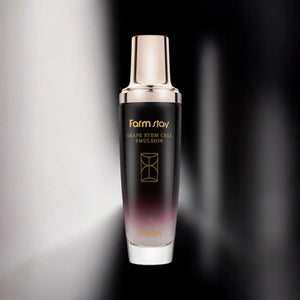 Skin TOGO Farmstay Grape Stem Cell Emulsion in a sleek black and purple gradient bottle for anti-aging skincare.
