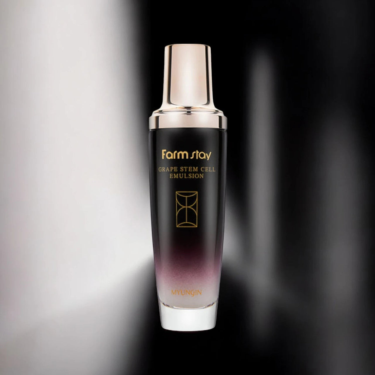 Skin TOGO Farmstay Grape Stem Cell Emulsion in a sleek black and purple gradient bottle for anti-aging skincare.