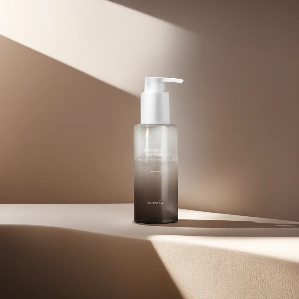 Skin TOGO Haruharu WONDER Black Rice Deep Cleansing Oil in a 150ml pump bottle on a minimalist beige surface.
