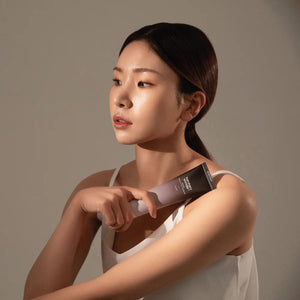 Skin TOGO model holding Haruharu WONDER Black Rice Moisture 5.5 Soft Cleansing Gel tube against a neutral background