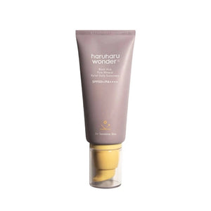 Skin TOGO Haruharu WONDER Black Rice Pure Mineral Relief Daily Sunscreen in a mauve tube with a yellow pump cap.