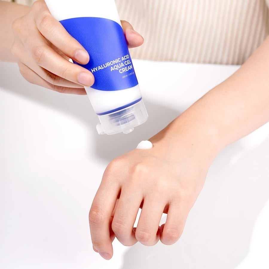 Skin TOGO Isntree Hyaluronic Acid Aqua Gel Cream being applied to a hand, showing its lightweight gel texture.