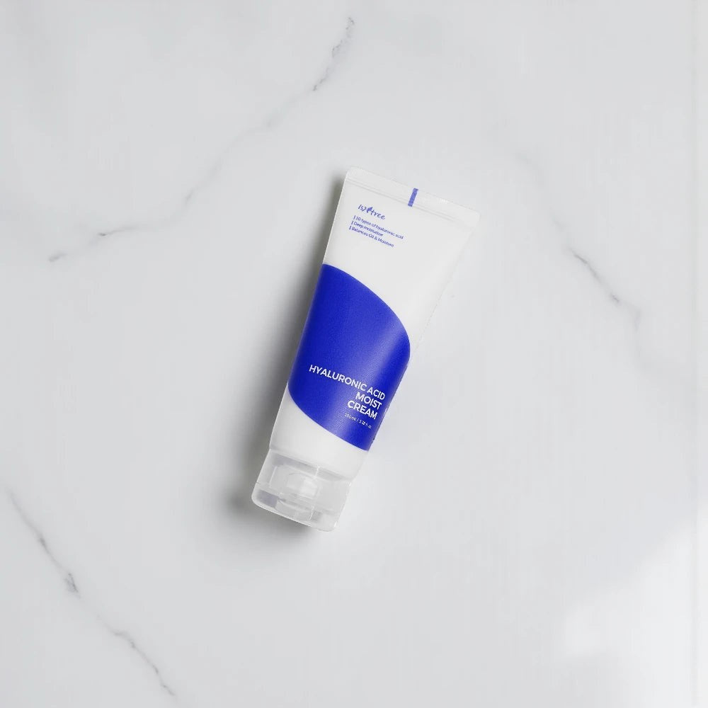 Skin TOGO Isntree Hyaluronic Acid Moist Cream in a white and blue 100ml squeeze tube on a white marble surface