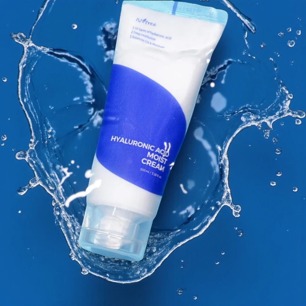 Skin TOGO Isntree Hyaluronic Acid Moist Cream tube in a refreshing water splash on a deep blue background.